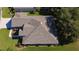 Birds eye shot showing a roof, well-manicured lawn, and trimmed landscaping enhance the home's curb appeal at 13968 Se 96Th Cir, Summerfield, FL 34491
