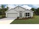 Charming single-story home featuring a two-car garage, neutral color palette, and well-maintained landscaping at 13709 Sw 42Nd Ave, Ocala, FL 34473