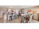 Open kitchen with stainless steel appliances, granite countertops, and a dining area perfect for Gathering gatherings at 13709 Sw 42Nd Ave, Ocala, FL 34473