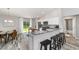 Open concept kitchen offers an eat in breakfast bar, stainless appliances, and outside access at 15319 Sw 54Th Avenue Rd, Ocala, FL 34473