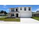 Charming two-story home with a spacious two-car garage and manicured front lawn at 15808 Se 101St Cir, Summerfield, FL 34491