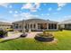 Aerial view of a backyard with a patio and green lawn at 2380 Nw 55Th Avenue Rd, Ocala, FL 34482