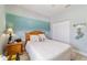 Cozy bedroom featuring a mural, wood accents and a closet for ample storage at 2380 Nw 55Th Avenue Rd, Ocala, FL 34482