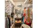 Walk-in closet featuring ample storage with clothes racks and a vintage vanity at 2380 Nw 55Th Avenue Rd, Ocala, FL 34482