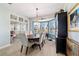 Formal dining room with a chandelier and a large bay window that fills the room with natural light at 2380 Nw 55Th Avenue Rd, Ocala, FL 34482