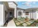 Inviting home entrance with decorative courtyard, pavers and seating area at 2380 Nw 55Th Avenue Rd, Ocala, FL 34482