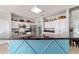 Kitchen featuring stainless steel appliances, granite countertops, white cabinets, and a blue accent island at 2380 Nw 55Th Avenue Rd, Ocala, FL 34482