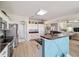 Spacious open kitchen with stainless appliances and breakfast bar at 2380 Nw 55Th Avenue Rd, Ocala, FL 34482