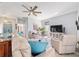 Open living space with wood floors and view to dining area, offering bright, natural light at 2380 Nw 55Th Avenue Rd, Ocala, FL 34482