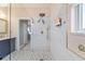 Modern bathroom features a glass shower with sleek gold hardware and patterned tile at 2380 Nw 55Th Avenue Rd, Ocala, FL 34482