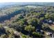 Aerial view of a private lot featuring dense woods at 2570 Se Highway 42, Summerfield, FL 34491