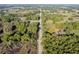 Aerial view shows a straight country road cutting through lush greenery at 2570 Se Highway 42, Summerfield, FL 34491