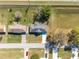 Aerial view of the property showcasing the roof, long driveway, and surrounding neighborhood at 3275 Nw 44Th Ct, Ocala, FL 34482