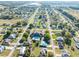Expansive aerial view of a well-maintained community with lush landscaping and a community pool and clubhouse at 3275 Nw 44Th Ct, Ocala, FL 34482