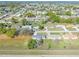 Overhead shot of the homes within a tranquil neighborhood, surrounded by trees at 3275 Nw 44Th Ct, Ocala, FL 34482