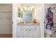Bathroom with granite countertop, cabinets, toilet, and tiled shower/tub at 3275 Nw 44Th Ct, Ocala, FL 34482