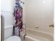 Bathroom with tiled shower/tub and grab bar at 3275 Nw 44Th Ct, Ocala, FL 34482
