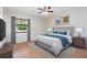Cozy bedroom featuring a Queen bed, neutral tones, and natural light from a large window at 3275 Nw 44Th Ct, Ocala, FL 34482