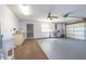 Spacious garage interior with ample storage space, a laundry area, and a roll-up door at 3275 Nw 44Th Ct, Ocala, FL 34482