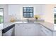 Bright kitchen with granite countertops, white cabinets, and stainless steel dishwasher at 3275 Nw 44Th Ct, Ocala, FL 34482