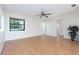Bright living room with wood flooring, a ceiling fan, and a large window at 3275 Nw 44Th Ct, Ocala, FL 34482