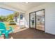 View of a screened porch with a sliding door, offering an indoor-outdoor living experience at 3275 Nw 44Th Ct, Ocala, FL 34482