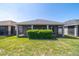 Back view of home showing the back patio and landscaping at 3935 Nw 46Th Ter, Ocala, FL 34482