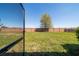 View of the backyard showcasing the fencing and a mature tree at 3935 Nw 46Th Ter, Ocala, FL 34482