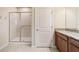 Bright bathroom features a glass-enclosed shower with grab bar and a granite countertop vanity at 3935 Nw 46Th Ter, Ocala, FL 34482
