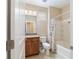 The full bathroom includes a tub with a shower and a vanity with a large mirror at 3935 Nw 46Th Ter, Ocala, FL 34482
