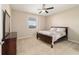 Bedroom with neutral walls, carpeted floors, and a ceiling fan at 3935 Nw 46Th Ter, Ocala, FL 34482