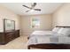 Bedroom with neutral walls, carpeted floors, and a dresser at 3935 Nw 46Th Ter, Ocala, FL 34482