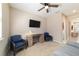 Cozy room features a ceiling fan, a window, a desk, a couch, and 2 chairs at 3935 Nw 46Th Ter, Ocala, FL 34482