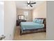 Cozy bedroom showcasing a ceiling fan, a window, and neutral walls at 3935 Nw 46Th Ter, Ocala, FL 34482