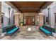 Inviting clubhouse entrance with decorative benches and an elegant double door entryway at 3935 Nw 46Th Ter, Ocala, FL 34482
