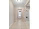 The tiled foyer features a decorative glass front door and a view into the home's living area at 3935 Nw 46Th Ter, Ocala, FL 34482