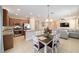 A modern kitchen features stainless steel appliances, granite counters, and an island with seating at 3935 Nw 46Th Ter, Ocala, FL 34482