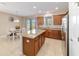 Bright kitchen features stainless steel appliances, granite countertops and sliding door access to the lanai at 3935 Nw 46Th Ter, Ocala, FL 34482