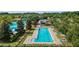 Aerial view of the community pool, showcasing the meticulous landscaping and resort-style amenities at 3935 Nw 46Th Ter, Ocala, FL 34482
