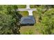 Aerial view of house nestled amongst many mature trees on a lush green lot at 4585 Se 136Th St, Summerfield, FL 34491