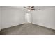Spacious bedroom featuring neutral carpeting and a ceiling fan for added comfort at 4585 Se 136Th St, Summerfield, FL 34491