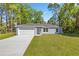 Charming single-story home with a well-manicured lawn, and a two car garage at 4585 Se 136Th St, Summerfield, FL 34491