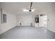 Spacious garage with ample room for parking and storage, featuring an epoxy floor at 4585 Se 136Th St, Summerfield, FL 34491