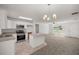 Eat in kitchen with stainless steel appliances, tile floor, and breakfast bar at 4585 Se 136Th St, Summerfield, FL 34491