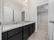 Bathroom with granite countertops, double sinks, and views into the Primary bedroom at 5048 Sw 57Th Pl, Ocala, FL 34474