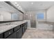 Bright bathroom features double vanity, a glass enclosed shower, and a relaxing tub at 5048 Sw 57Th Pl, Ocala, FL 34474