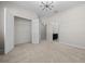 Spacious bedroom with neutral carpet, closet, and views into the ensuite bath at 5048 Sw 57Th Pl, Ocala, FL 34474
