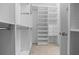 Walk-in closet with custom shelving and storage, ideal for organization at 5048 Sw 57Th Pl, Ocala, FL 34474