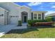 Charming single-Gathering home with a well-manicured lawn and lush landscaping at 5048 Sw 57Th Pl, Ocala, FL 34474