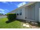 Charming home exterior with a lush green lawn and meticulously maintained landscaping at 5048 Sw 57Th Pl, Ocala, FL 34474